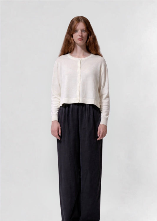 model shot wearing a cream cropped boxy cardigan