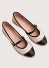 Beige flat shoe with black cap-toe and woven sole 
