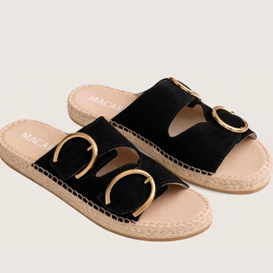 Black suede sandal with gold buckles and an espadrille sole 