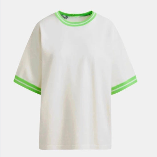 White t-shirt with green trim on a white background