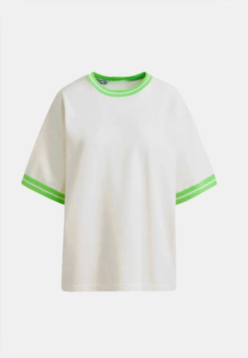 White t-shirt with green trim on a white background