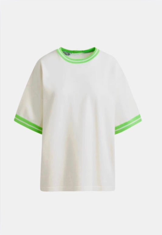 White t-shirt with green trim on a white background