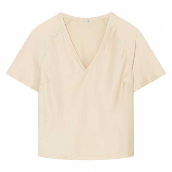 cream silk blouse with a V-neck 