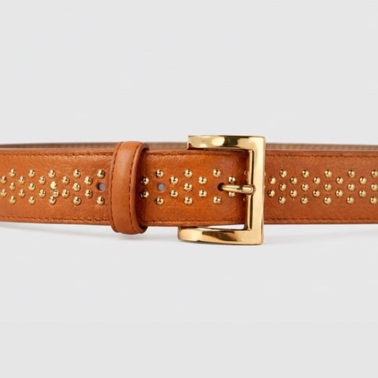 tan belt with gold studs and buckle