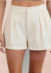 white pleated shorts
