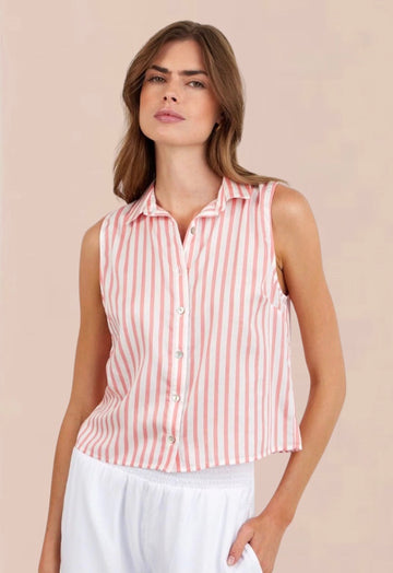 Woman wearing a sleeveless pink and white striped shirt against a beige background