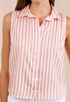 Woman wearing a sleeveless pink and white striped shirt against a beige background