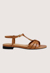 Brown sandal with a black sole on a light gray background