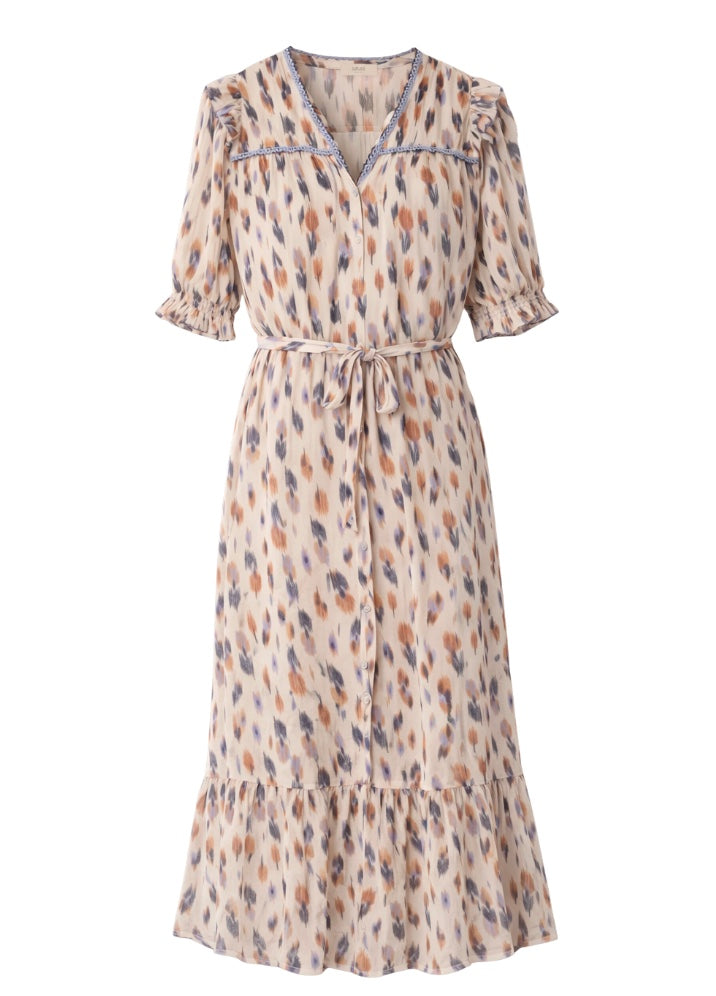 cream patterned dress with a belt and colourful poka dotts