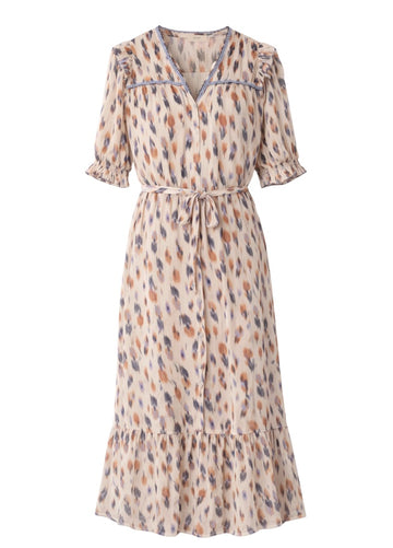 cream patterned dress with a belt and colourful poka dotts