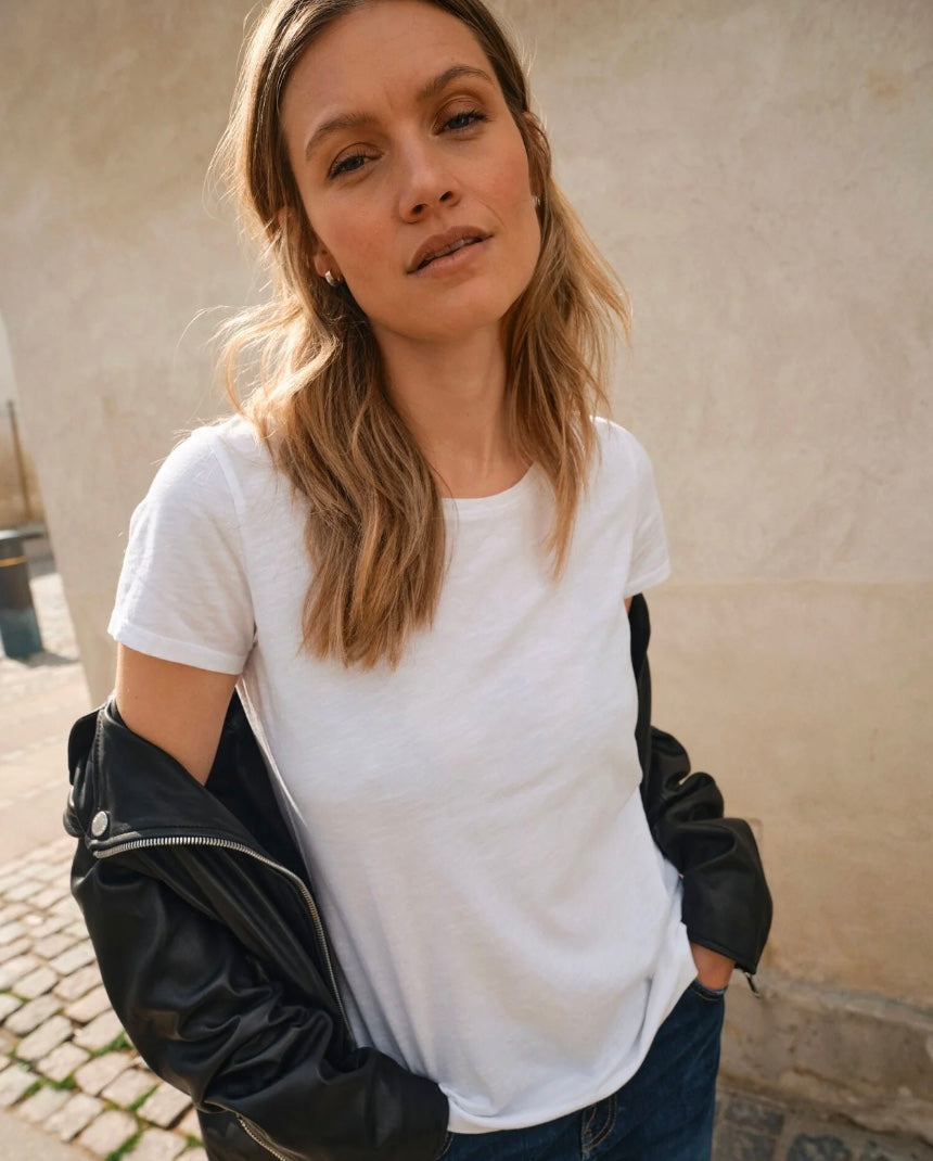 model wearing white round neck cotton t-shirt