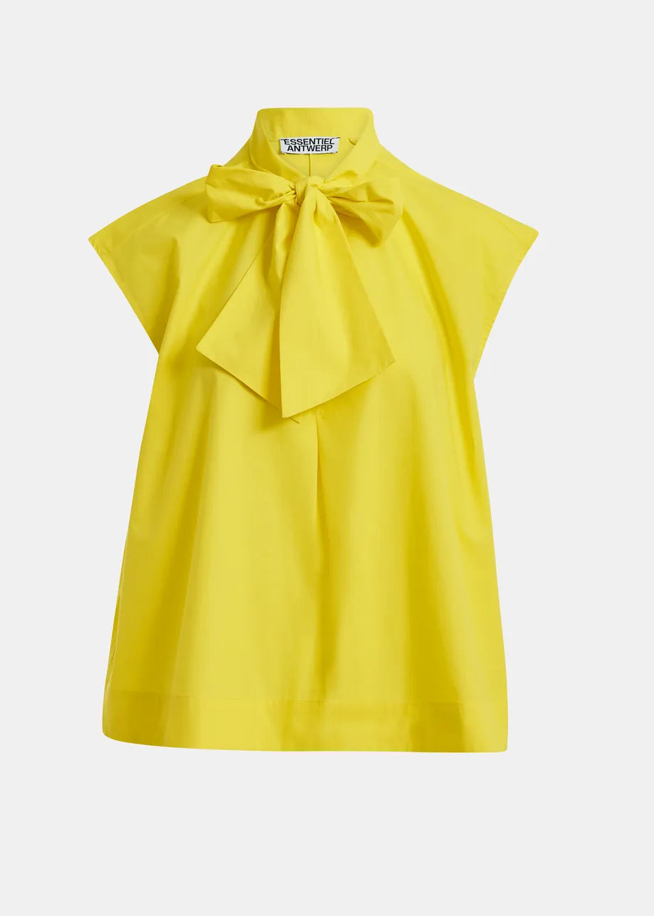 Yellow blouse with a large bow on a white background