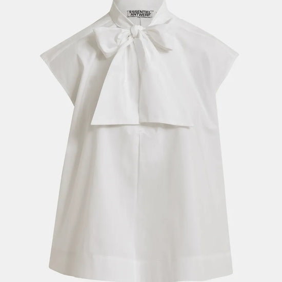 White blouse with a bow detail on a white background