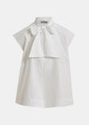 White blouse with a bow detail on a white background