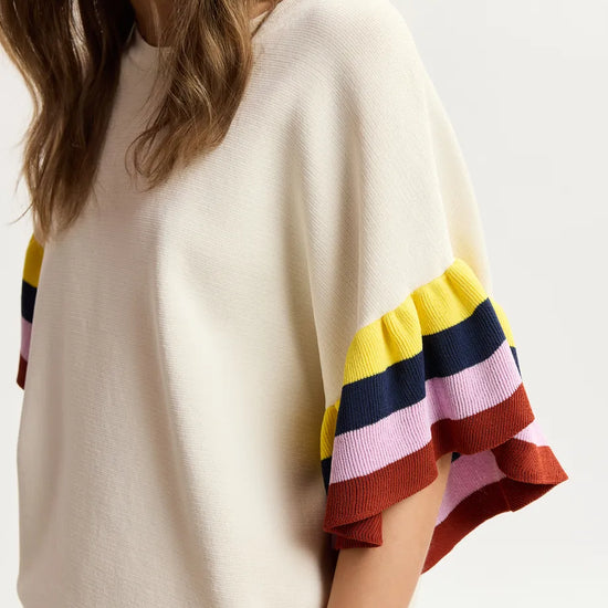 Beige sweater with colorful sleeves on a white background