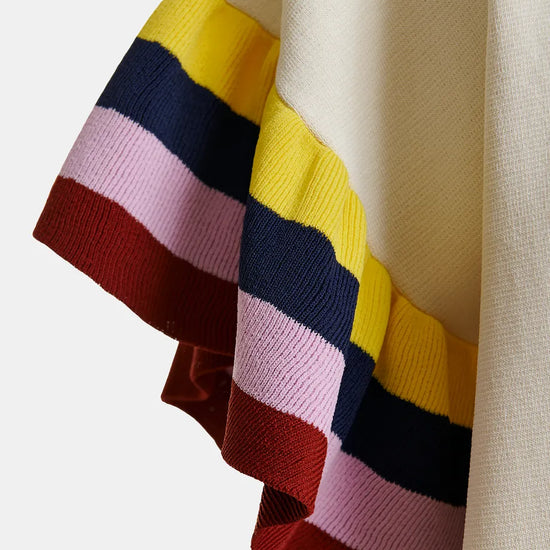 Close-up of a colorful striped fabric with a neutral background