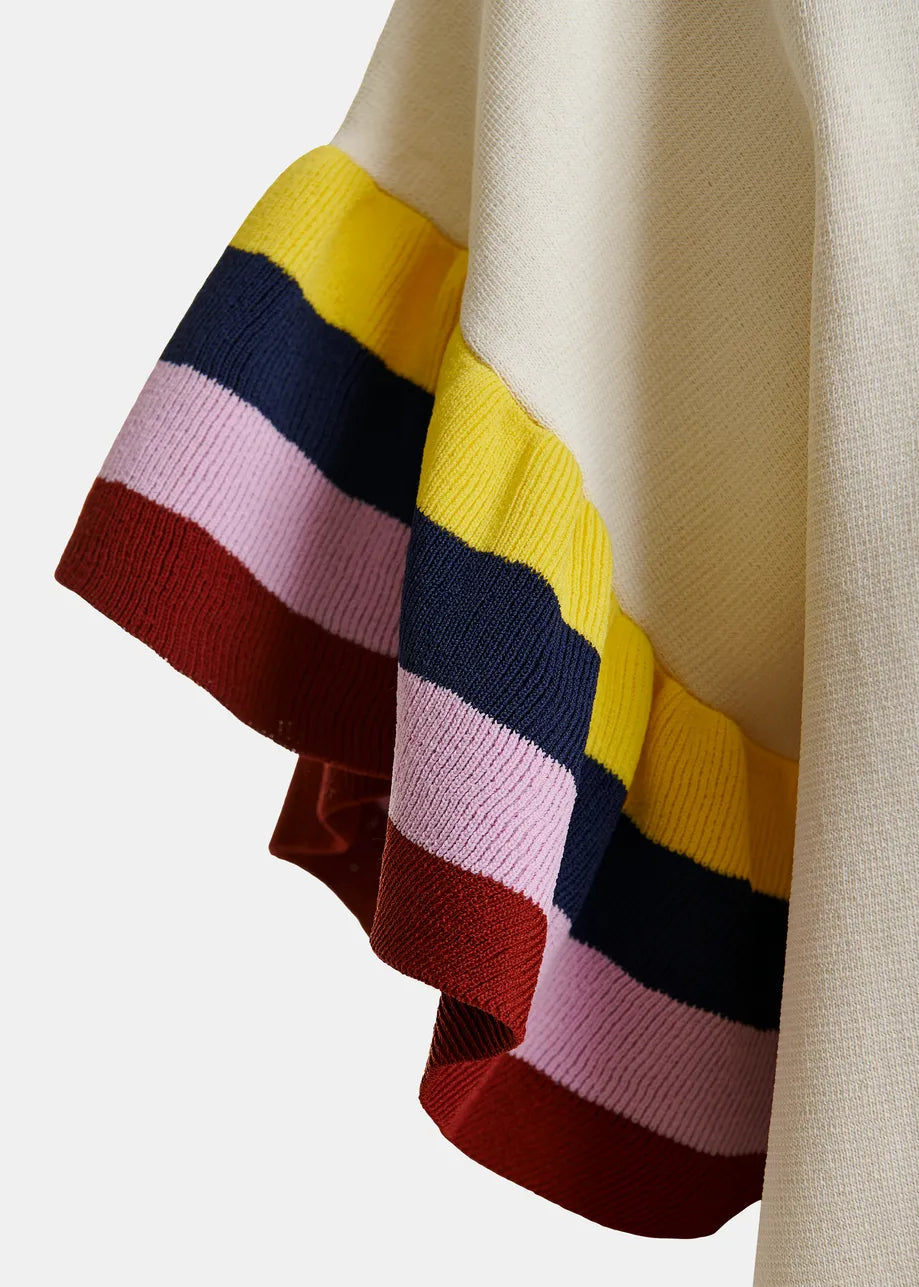 Close-up of a colorful striped fabric with a neutral background