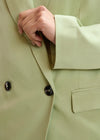 light green double breasted oversized blazer from essentiel antwerp close up