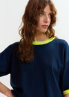 navy blue short sleeve top with yellow trim from essentiel antwerp close up