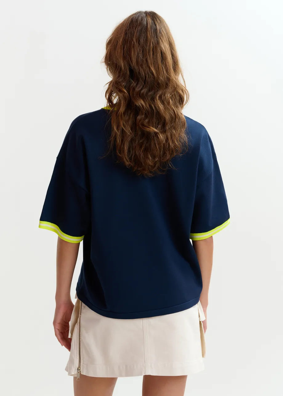 navy blue short sleeve top with yellow trim from essentiel antwerp rear 