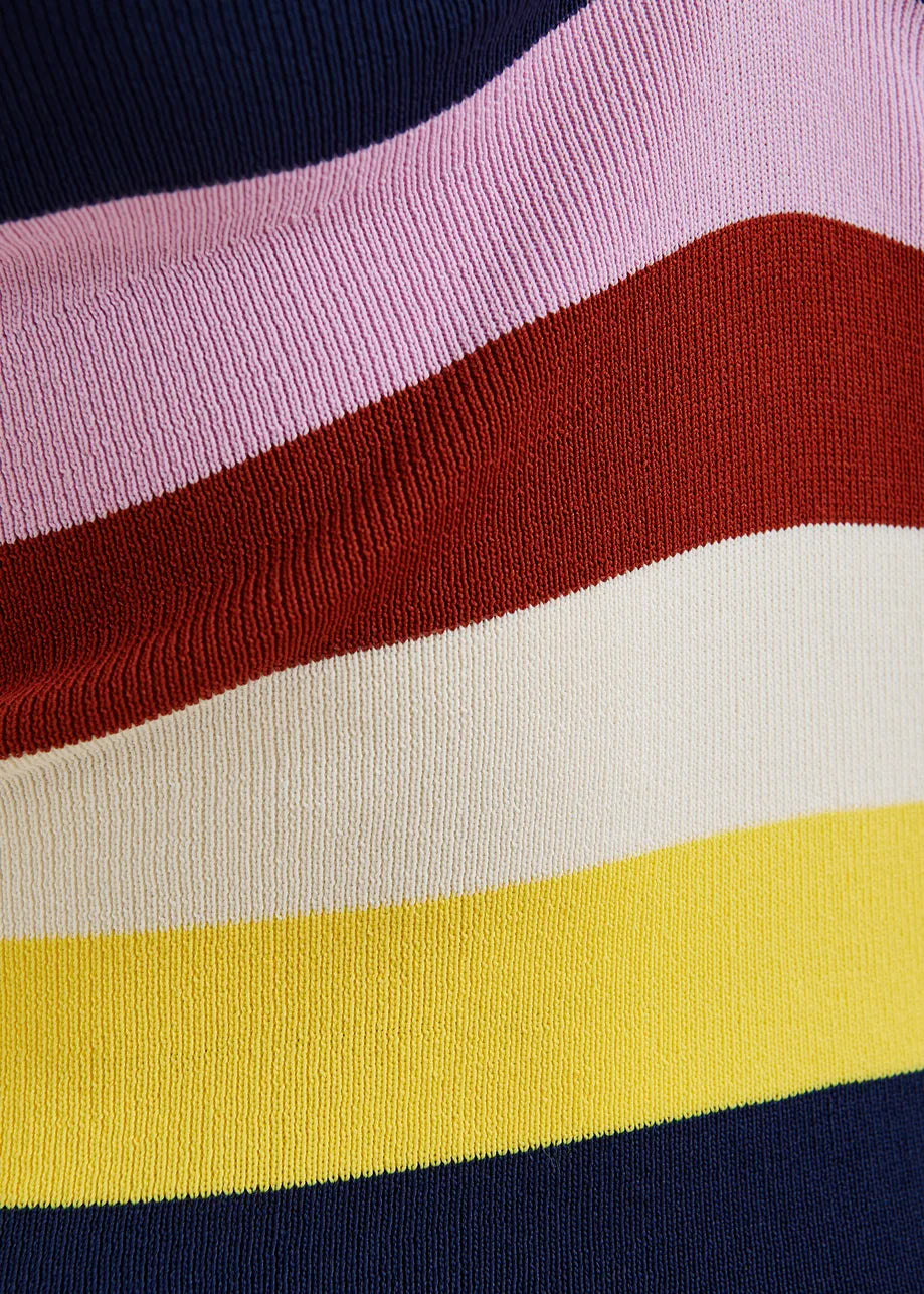 Close-up of a sweater with colorful horizontal stripes in pink, red, white, yellow, and navy.