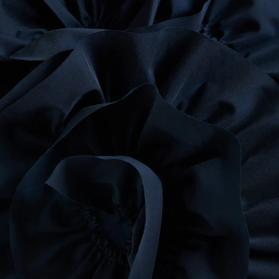 Close-up of dark blue fabric with folds
