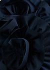 Close-up of dark blue fabric with folds