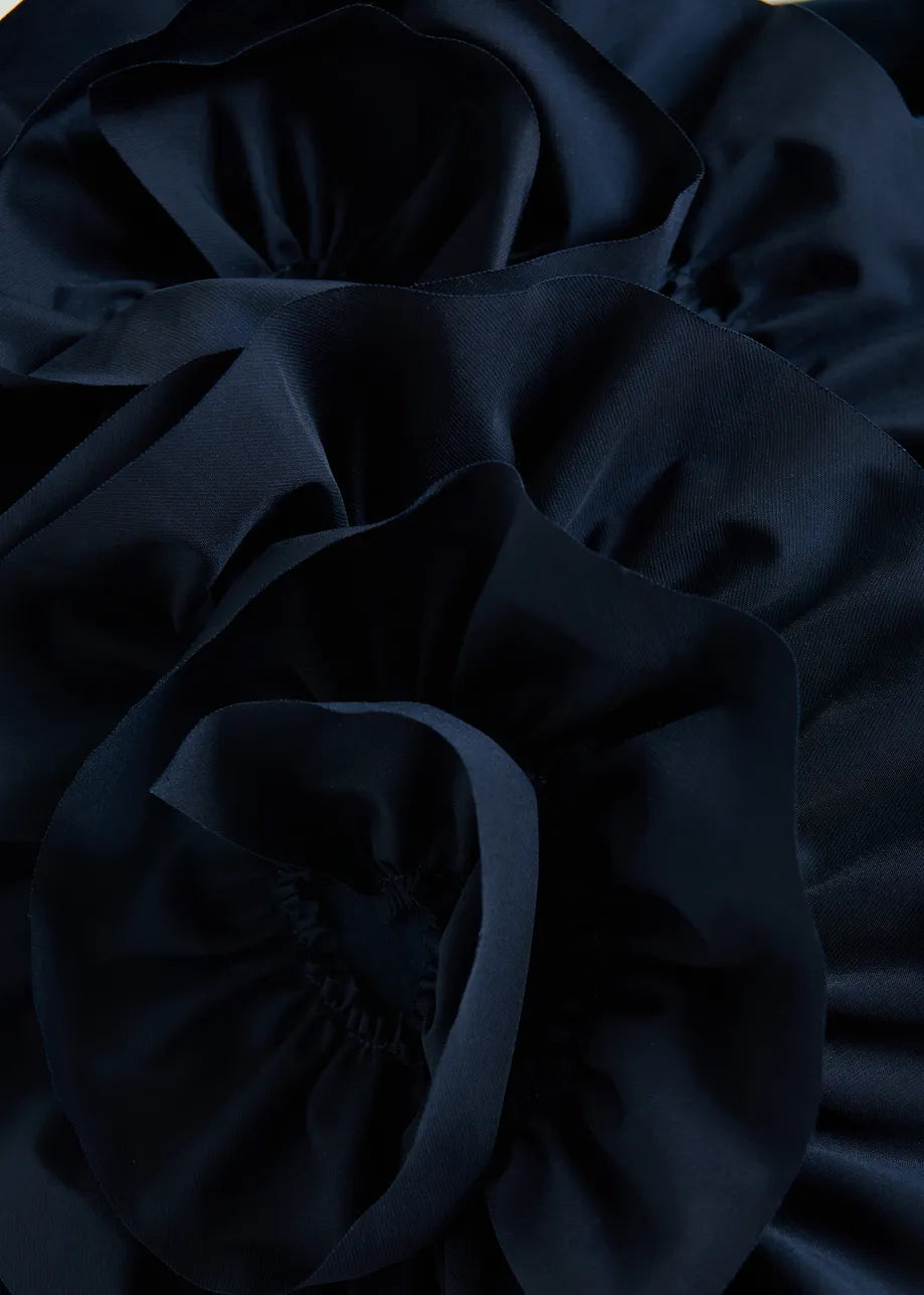 Close-up of dark blue fabric with folds