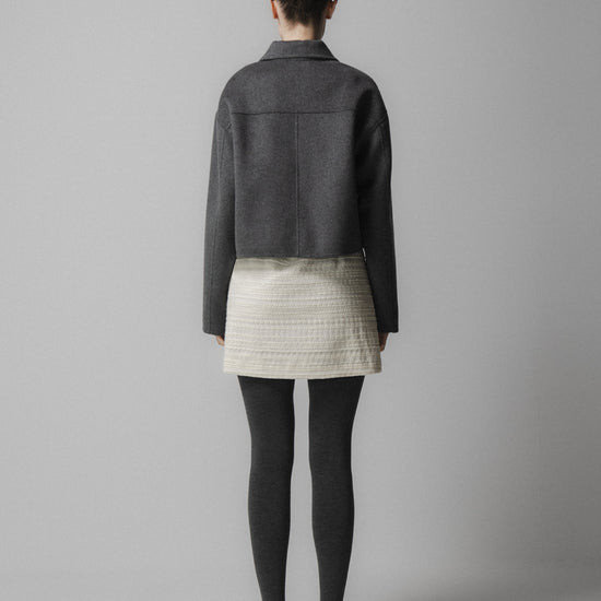 charcoal grey cashmere wool mix jacket with slanted welt flap pockets rear view