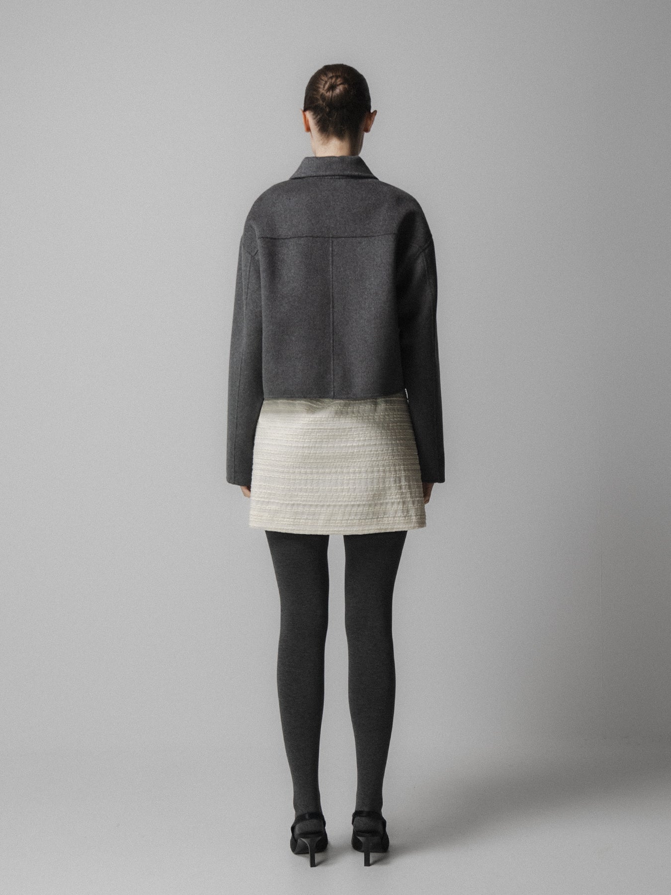 charcoal grey cashmere wool mix jacket with slanted welt flap pockets rear view