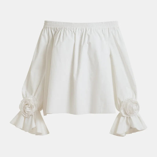 White blouse with ruffled sleeves on a white background