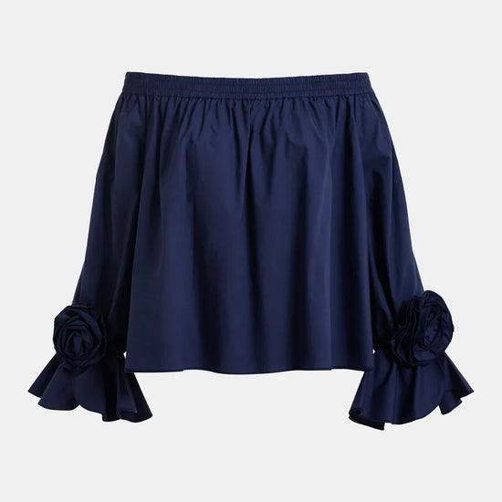 Navy blue skirt with floral details on a light gray background