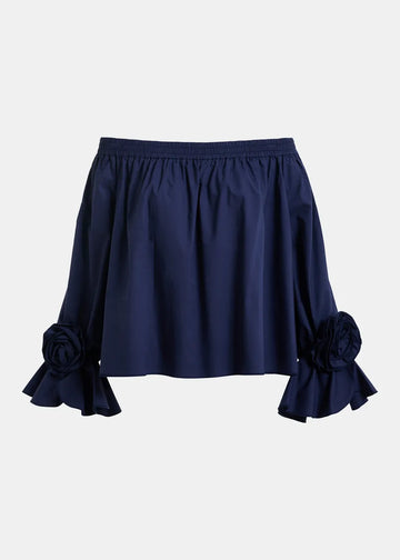 Navy blue skirt with floral details on a light gray background