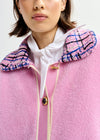 pink textured jacket with pattern collar and patch pockets close up