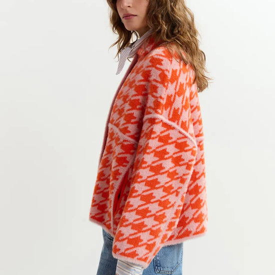 houndstooth red textured jacket with pink background  side