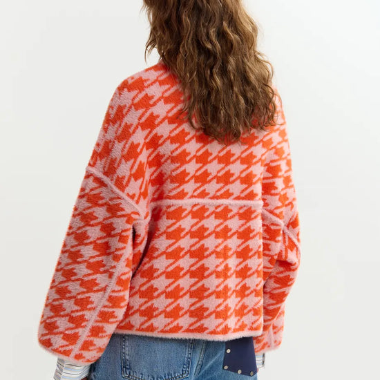houndstooth red textured jacket with pink background  rear