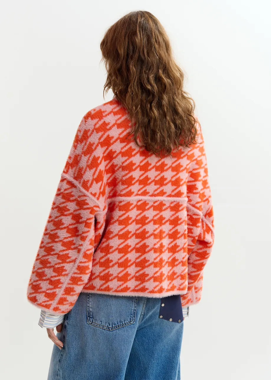 houndstooth red textured jacket with pink background  rear