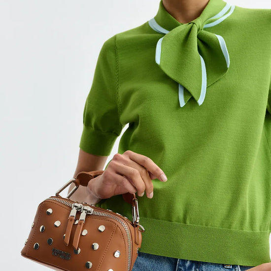 short sleeve green knit with tie at the neck close up