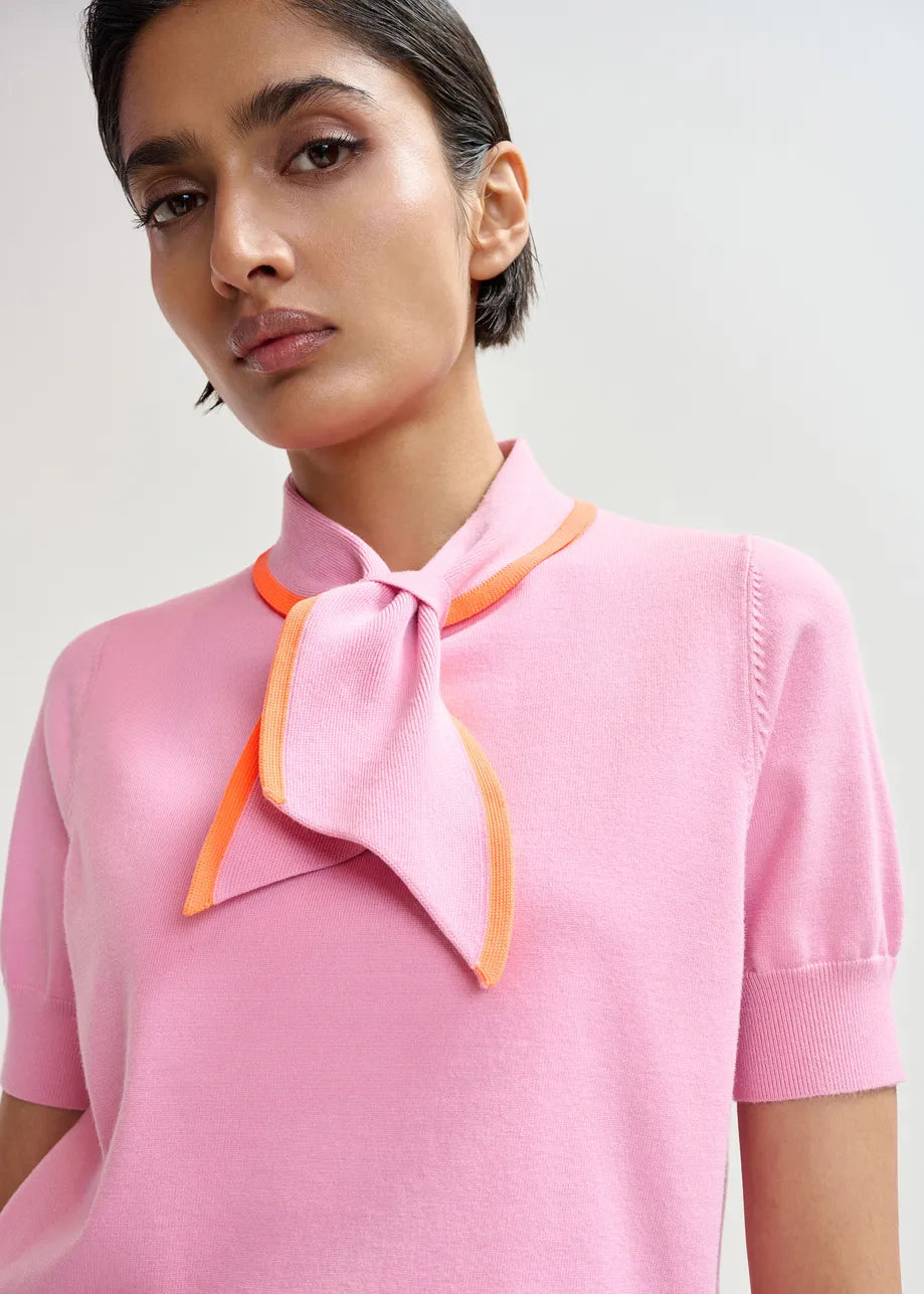 short sleeve pink knit with tie at the neck close up