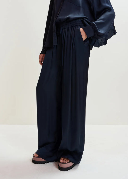 navy blue satin drawstring waist wide leg sweat pants model