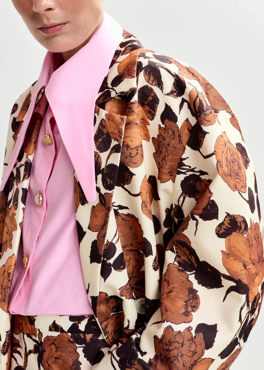 brown floral print double breasted mid length coat  close up