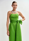 strapless green midi dress with large tie at the front close up