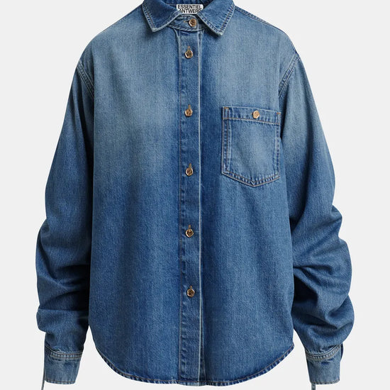 Blue denim shirt on a light gray background