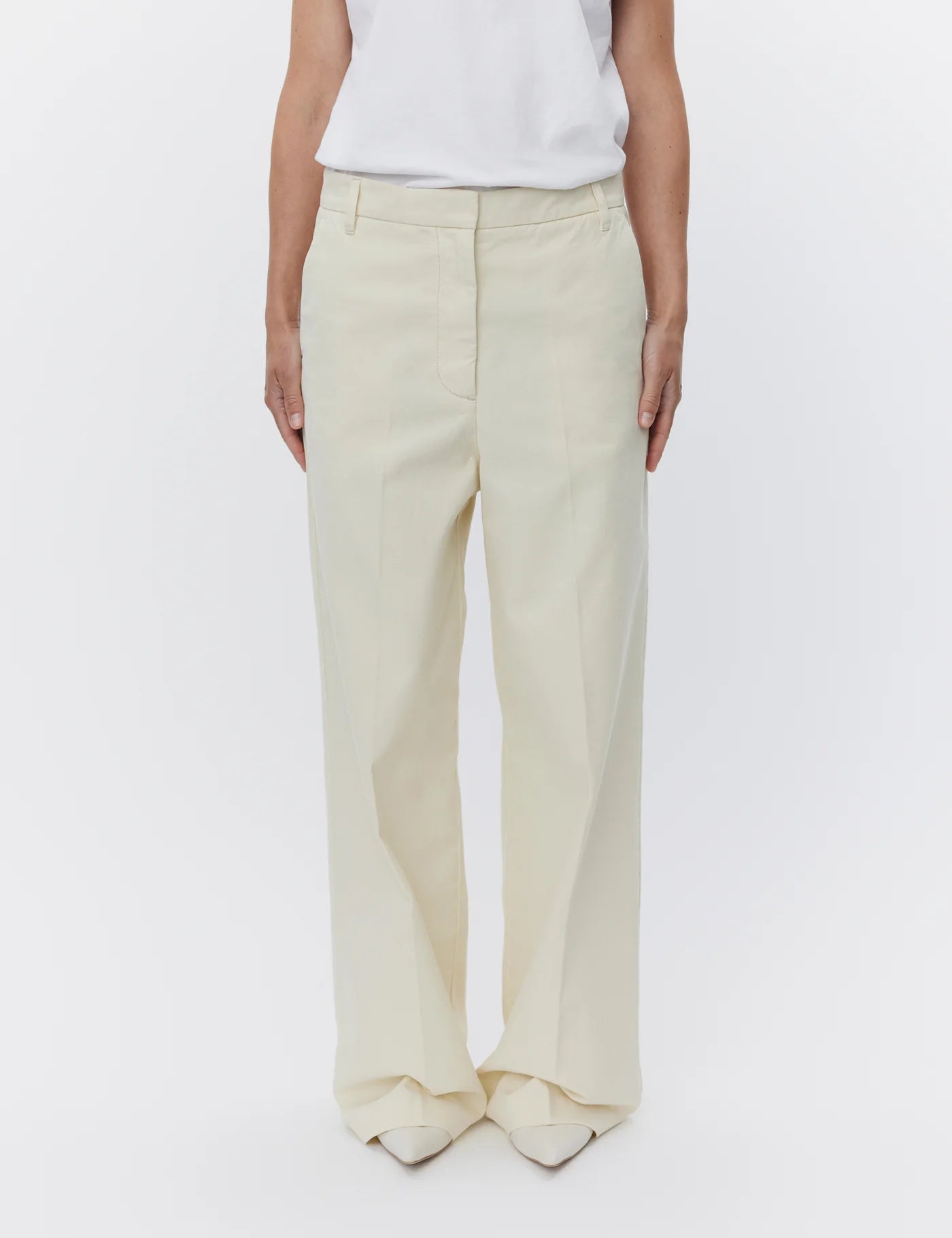 ecru relaxed trousers with optional tie belt and side pockets model shot