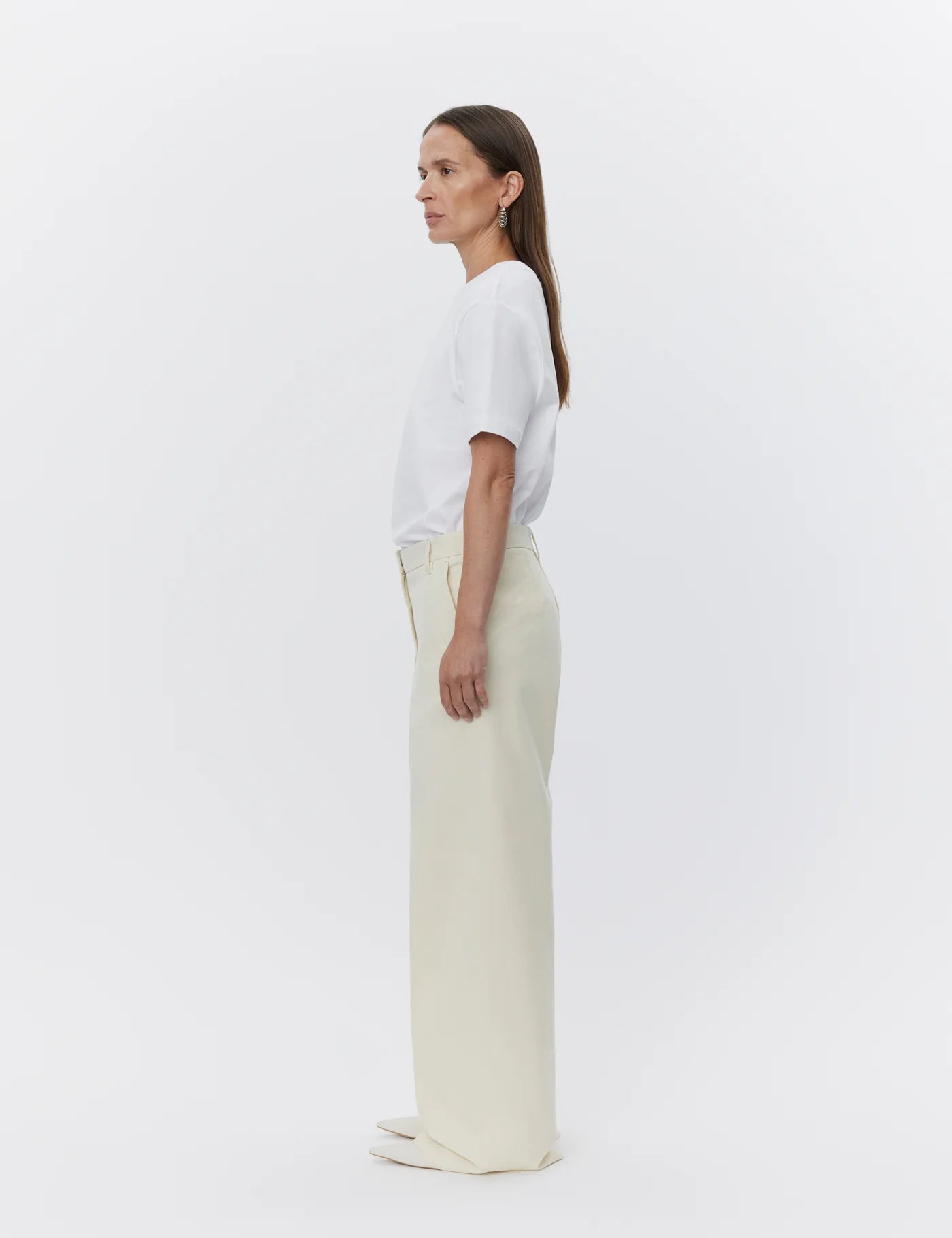 ecru relaxed trousers with optional tie belt and side pockets side view 