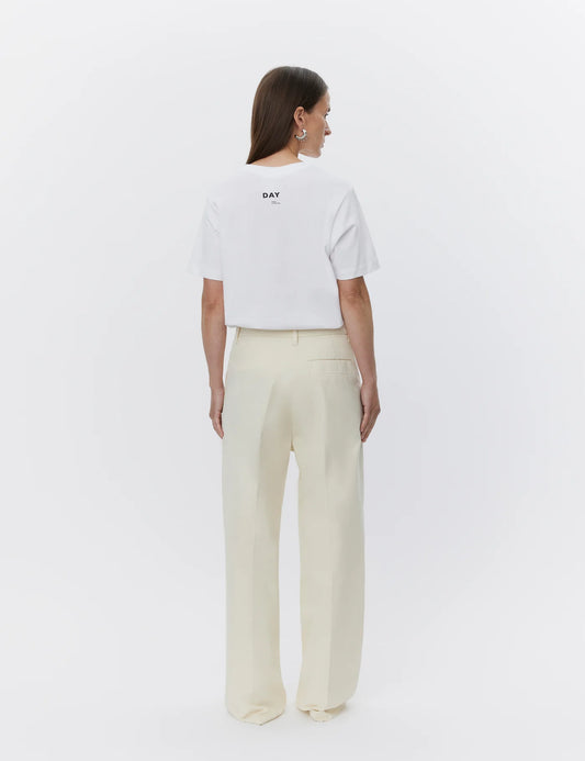 ecru relaxed trousers with optional tie belt and side pockets rear view 