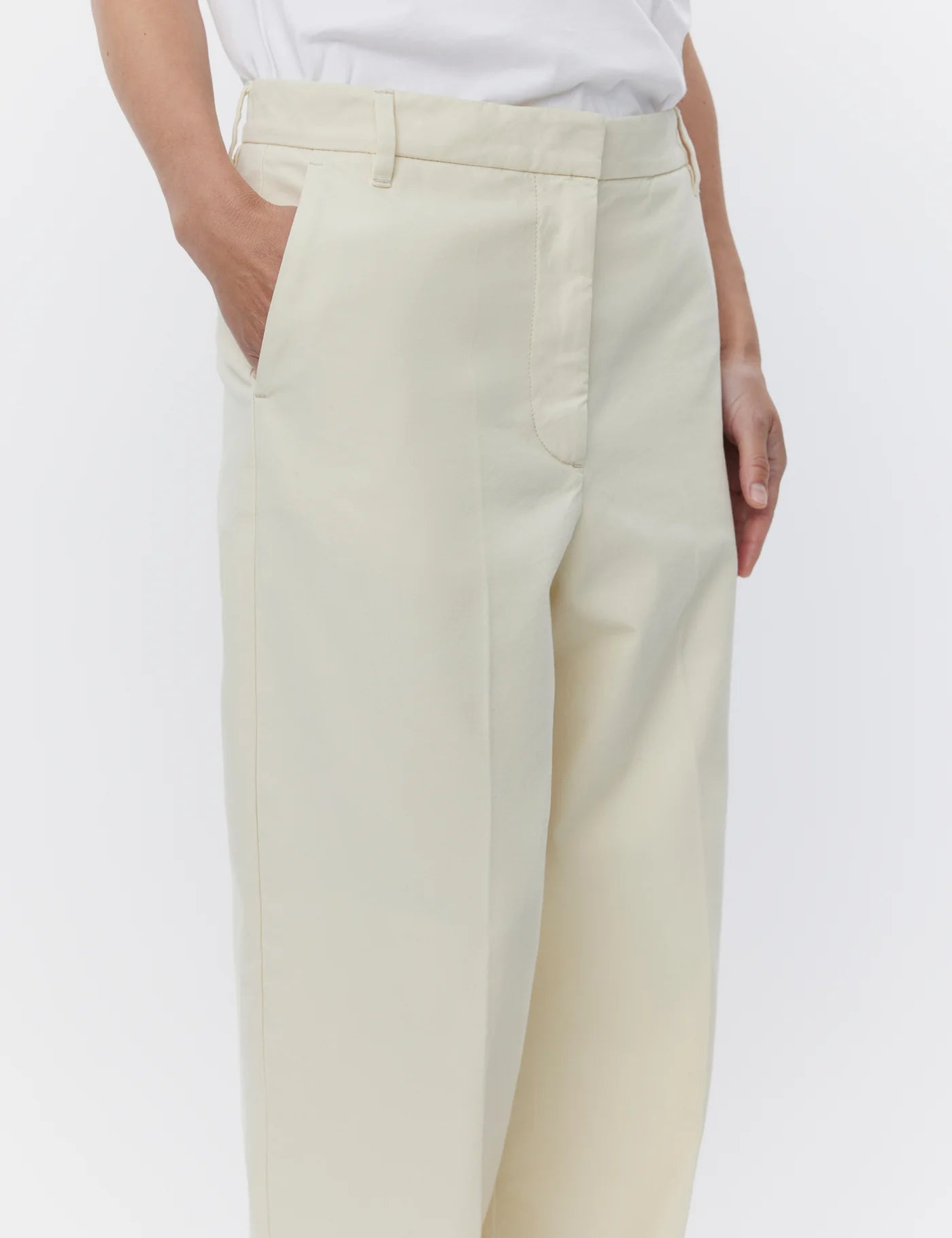 ecru relaxed trousers with optional tie belt and side pockets close up