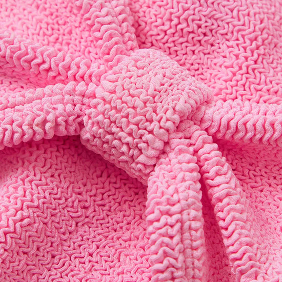 pink crinkle strapless bikini from hunza g close up of fabric