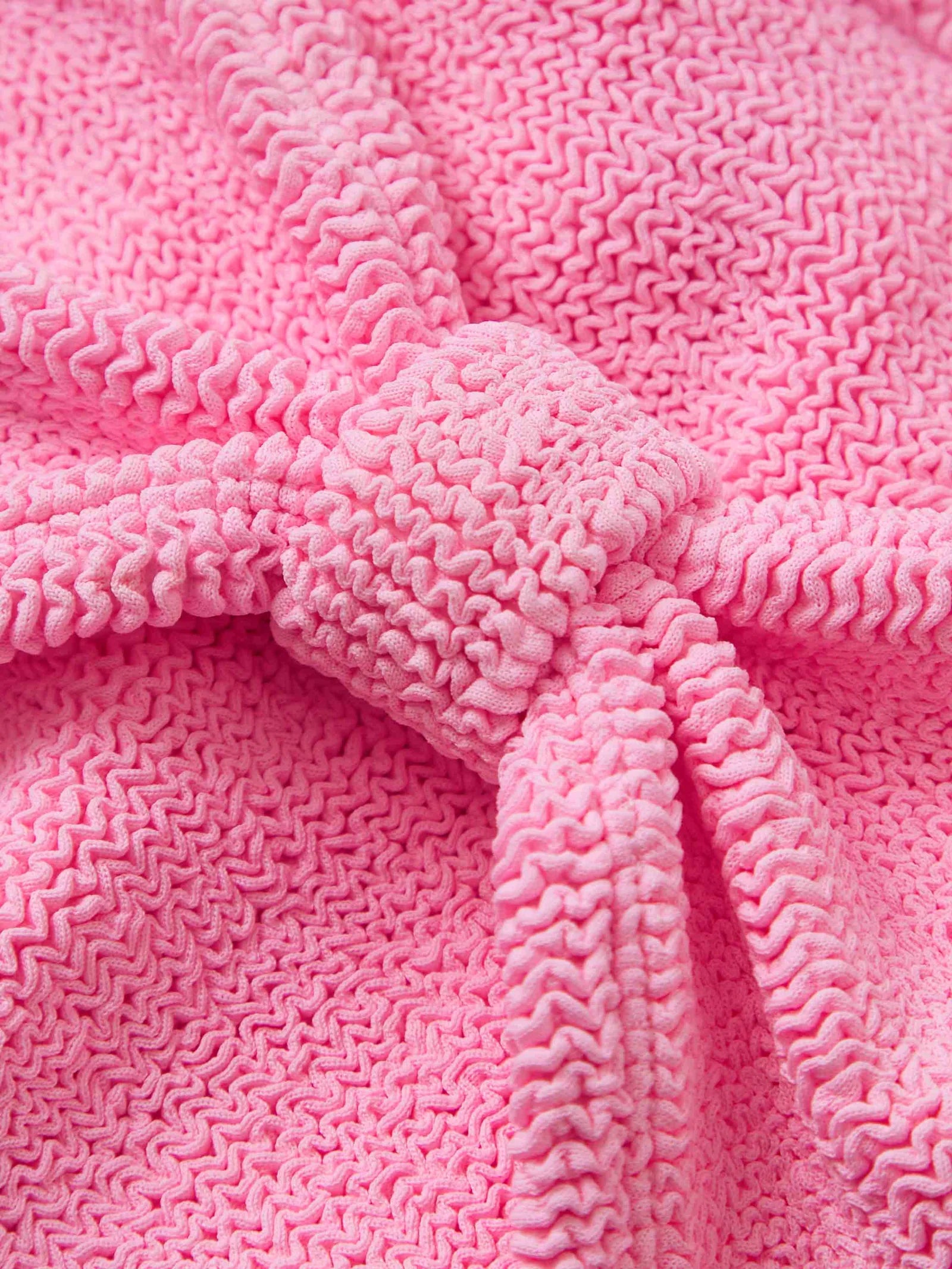 pink crinkle strapless bikini from hunza g close up of fabric
