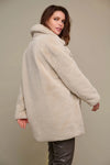 Ecru double breasted mid-length faux fur coat with brown buttons and classic collar